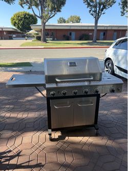 Nexgrill BBQ grill with propane tank