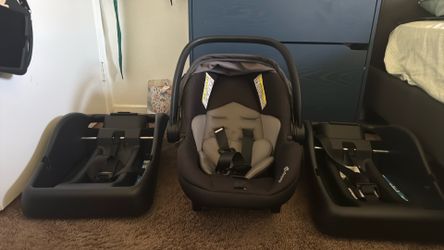 baby carrier , grey and black with two base