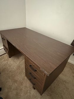 big wooden desk with drawers