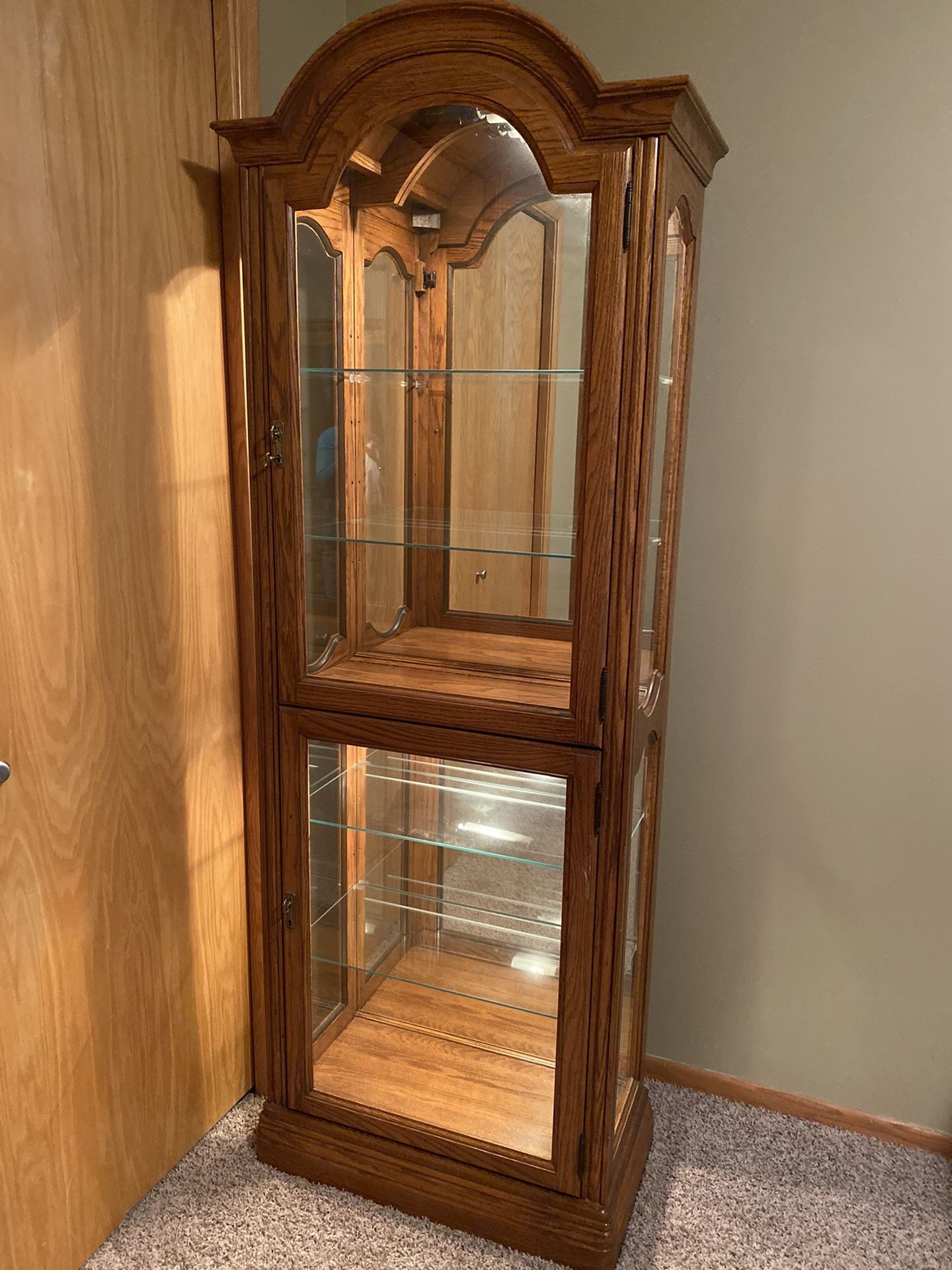 Six shelf light Curio Cabinet. Both upper and lower lock w/key.