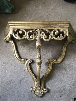 Shelf/table that hangs on wall
