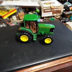 John Deere Plastic Tractor. 6 Inches Long. 4 Inches Tall. Like New Condition 