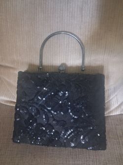 Black evening sequin clutch.