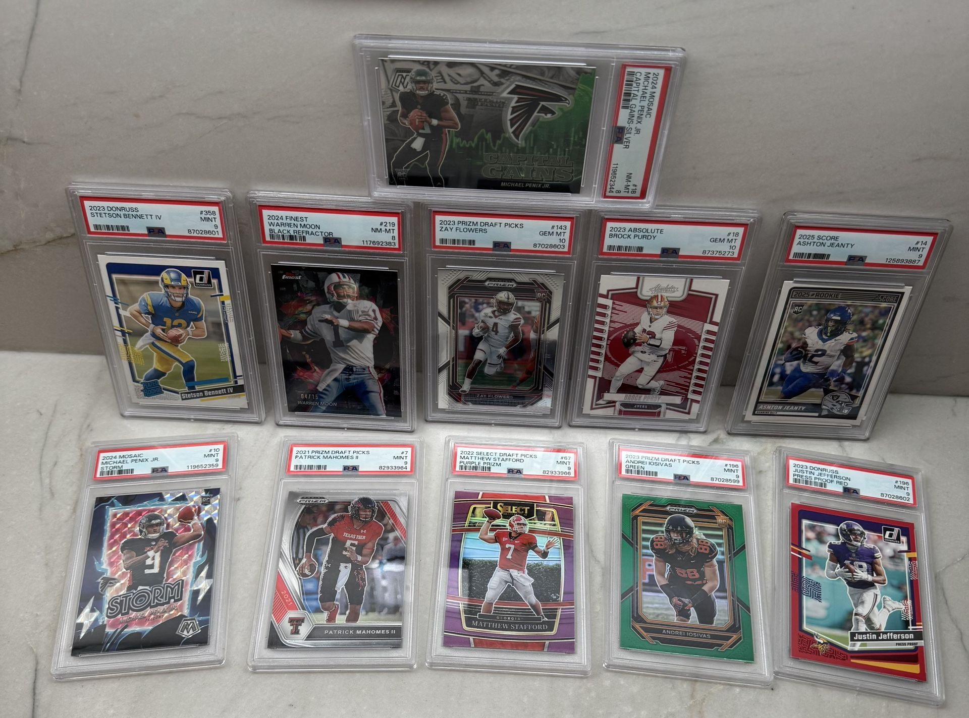 11 PSA Graded NFL Football Cards.. Mahomes, Penix JR. , Stafford 75/75, Purdy, Jeanty, Jefferson, Moon 4/15 & More