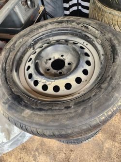 4 USED MICHELIN ALL SEASON  215/65 R16 TIRES AND RIMS