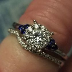 Beautiful solid 925 silver rodium plated over top of it with AAA white cz's and blue sapphires. Size 7