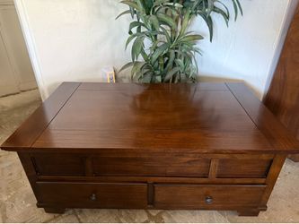 Lift Top Coffee table made by Ashley