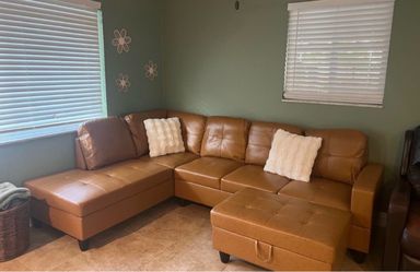 Carmel leather sectional couch and ottoman