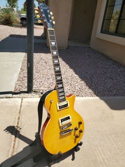 Vintage yellow LP style mahogany back maple top guitar