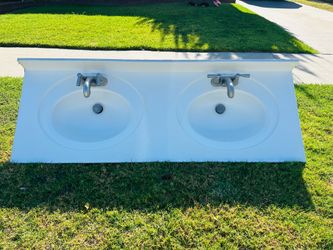 Free 61 inch vanity sink top with 2 newer Moen Faucets