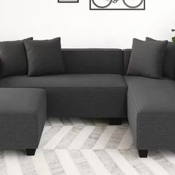 Large dark gray chaise sectional couch / sofa with ottoman

