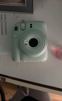 Light green Polaroid camera