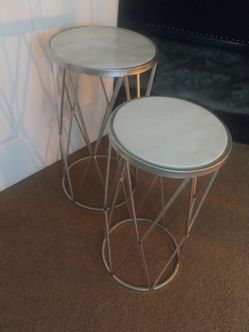 Silver and white marble tables