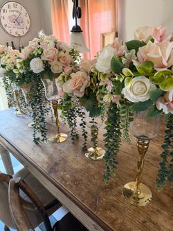 Tall Gold Candle Holders with Floral Centerpieces