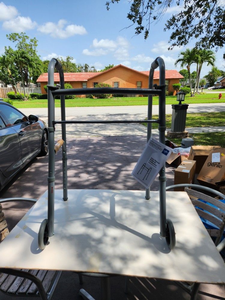 Brand New Folding Walker, Two Button with 5" Wheels read description for details see pictures