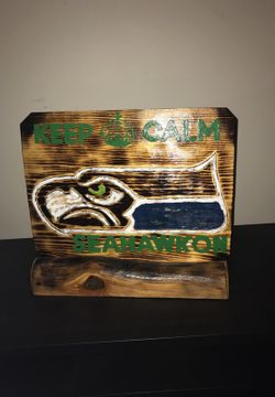 Seahawks bar sign with stand.
