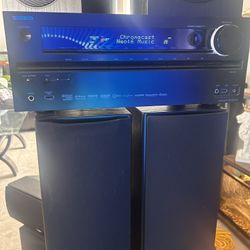 Onkyo audio system, two Pioneer speakers, one Polk Audio center speaker, two Polk Audio tower speakers, and a Definitive subwoofer, all cables include