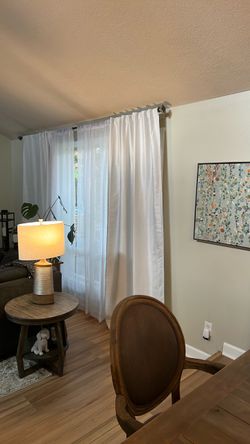 4 White lined curtain panels with 4 white textured sheers. Rods are not included.