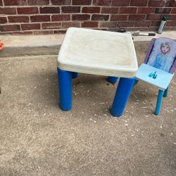 A Beautiful Princesses Chair With A Table That Needs Cleaning