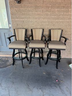 Three Swiveling barstools