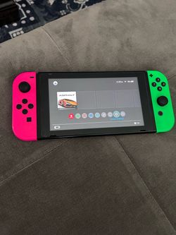 Nintendo Switch with Neon Pink and Green Joy-Cons