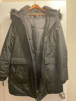 Warm black coat with a fur-lined hood.