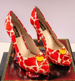 Vintage womens 8.5  Hello Kitty Peep toe Heels with hearts and heart embellishment.