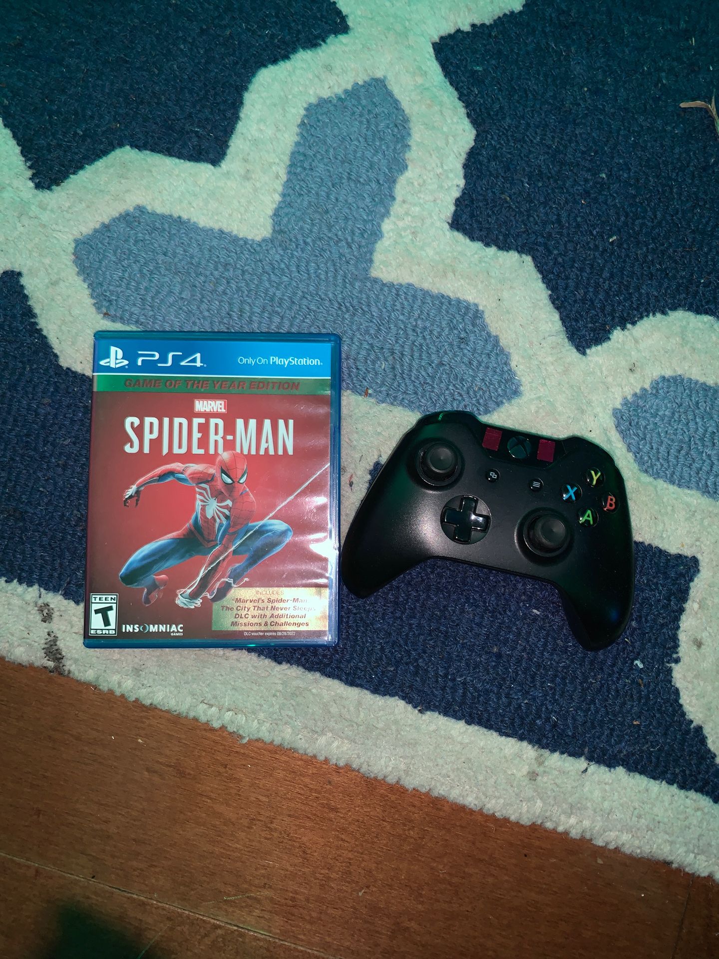 Xbox controller and spider man game of the year edition