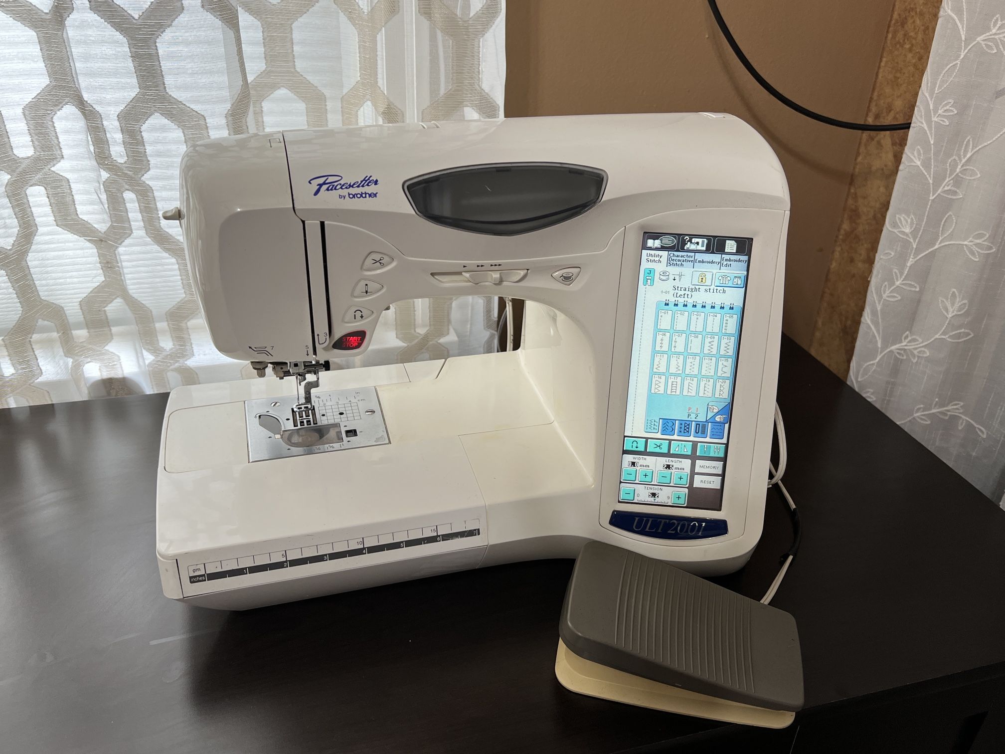 Brother Embroidery and Sewing Machine with a Cabinet.