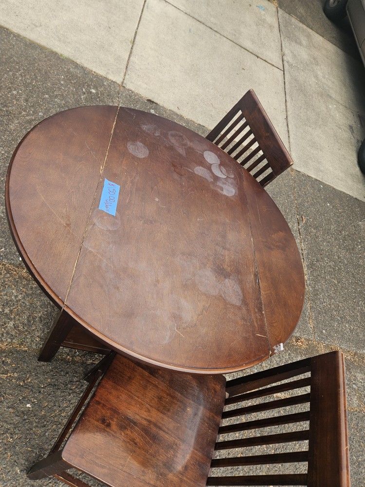 Solid Wood Dining Swt With Drop Down Eaves.
