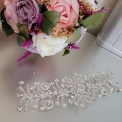 Crystal hair band with wedding bridal bouquet.