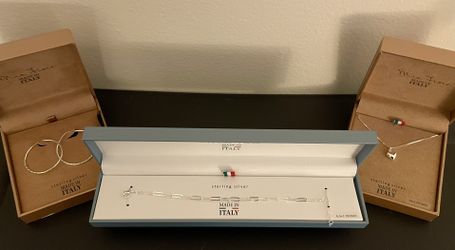 Sterling silver bracelet, necklace, and earrings