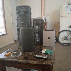 Three Bluetooth Speakers And One iPad Air 2