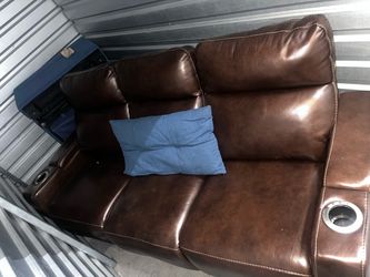Brown Leather Reclining Loveseat with Cup Holders