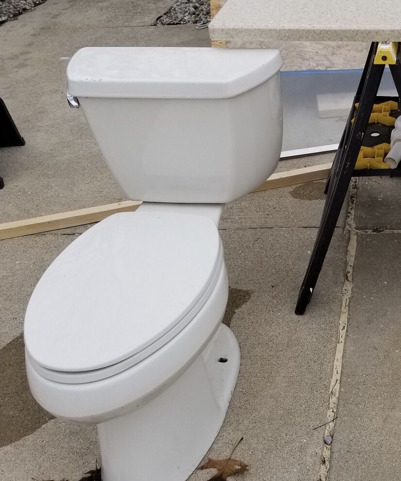 Kohler toilet (biscuit color) chair height with elongated bowl