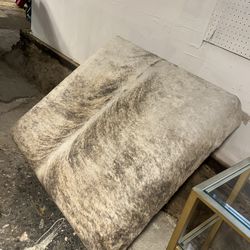 Ottoman: large hair on hide with stainless steel legs