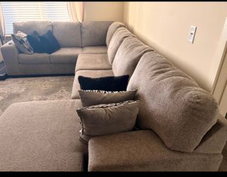 Sectional with throw pillows.
