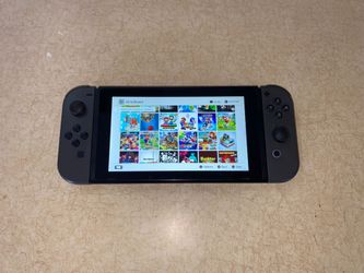 NINTENDO SWITCH with 125 SWITCH GAMES