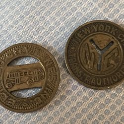 TWO (2) VINTAGE TRANSIT TOKENS 