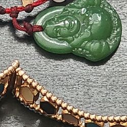 UP FOR SALE A BUNDLE OF FANTASY JULERY THAT INCLUDES, A JADE BUDDHA CHARM PENDANT, EARRINGS, BRAZALET X2 AND MORE