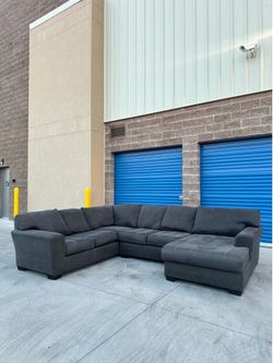 Ashley’s dark grey Sectional sofa couch with chaise