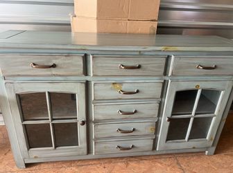 Beautiful solid buffet/server with glass cabinet doors, seven drawers, and adjustable shelving