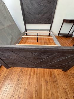 Full size bed frame. Bob’s furniture, dark gray wood grain