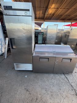 The refrigerator and refrigerated prep table—both True brand—are working very well, maintaining a temperature of around 35°F, and are very clean.