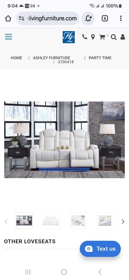 White leather Loveseat 2 recliners, with center storage console and 2 cup holder's