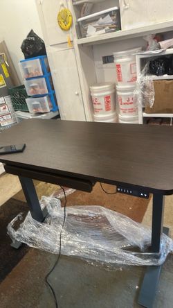 Height adjustable table