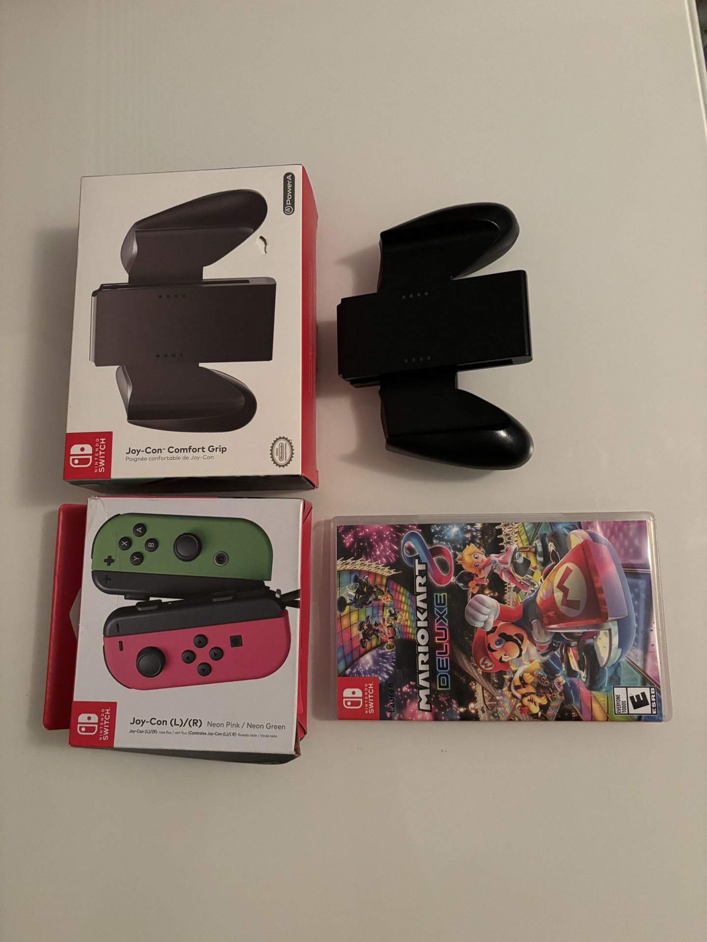 Nintendo switch controller pack with two comfort controller grips. Comes with Mario cart deluxe.