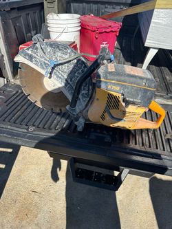 Gas-powered Partner K750 cut-off saw has a 14-inch diamond blade. This orange and black power tool is equipped with an active air filtration system an