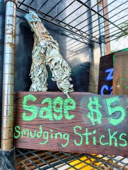 Dried wrapped sage sticks for smudging at $5 Farm Stand on Harris Trail