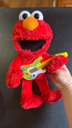 Sesame Street Elmo Red Plush with Yellow Guitar. Works well.